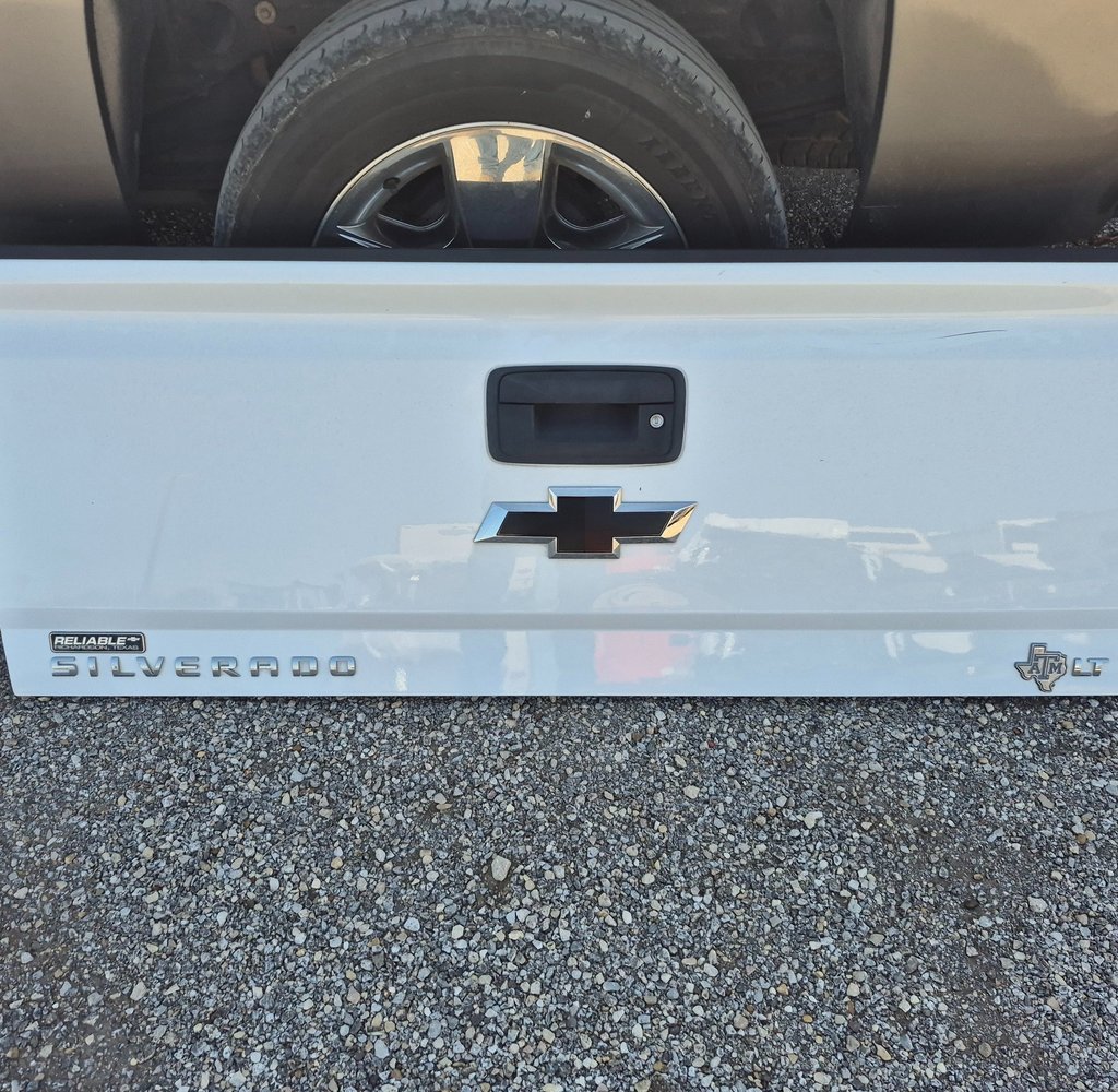 White Silverado tailgate repair detail